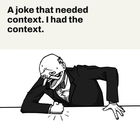 oori laughing hard and slamming his fist on a table. Caption: A joke that needed context. I had the context.